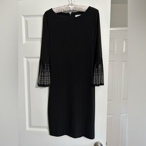 Elegant Calvin Klein Black Dress with Embellished Sleeves